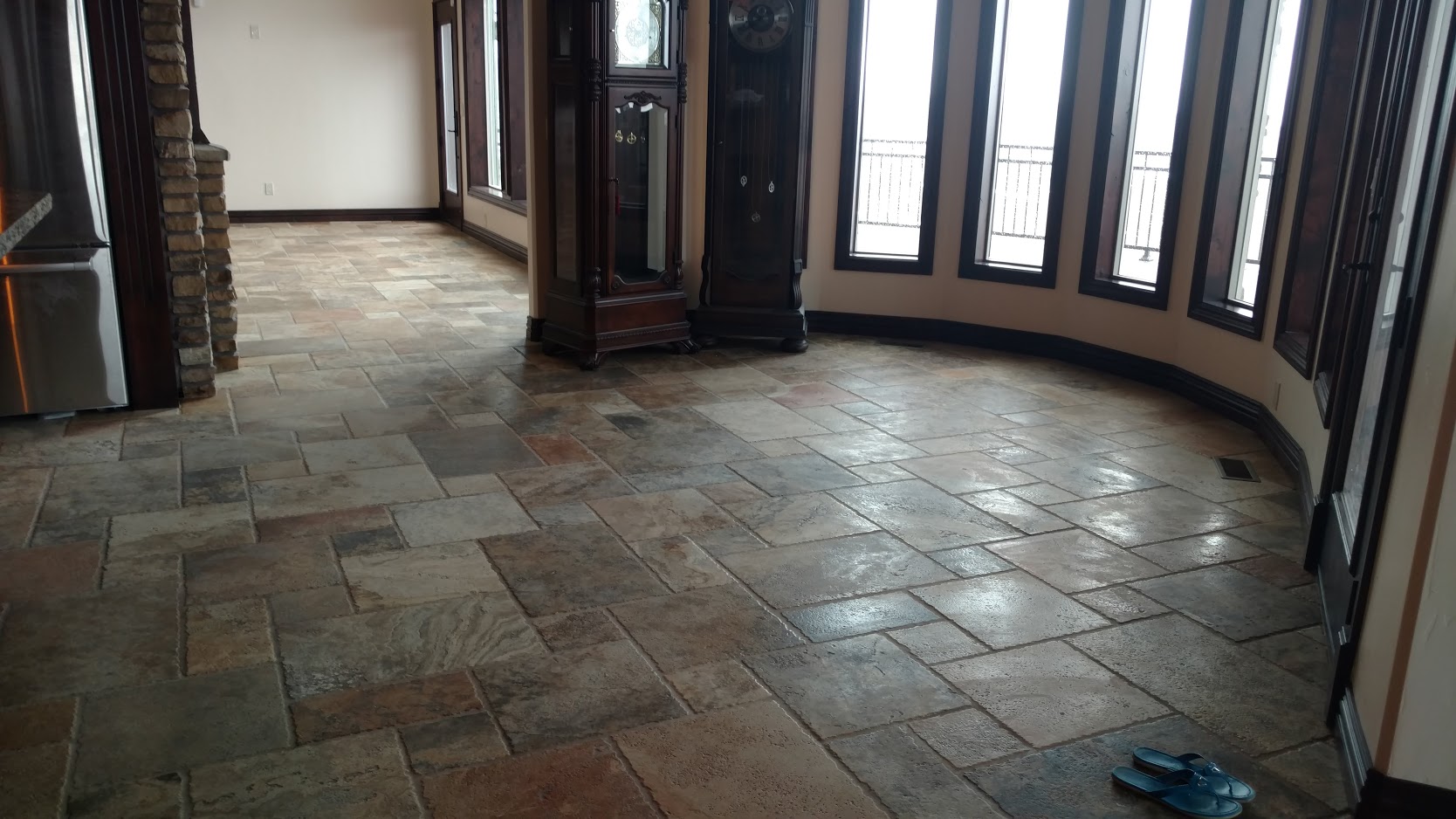 Kitchen floor tiled with colorful slate in multiple sizes
