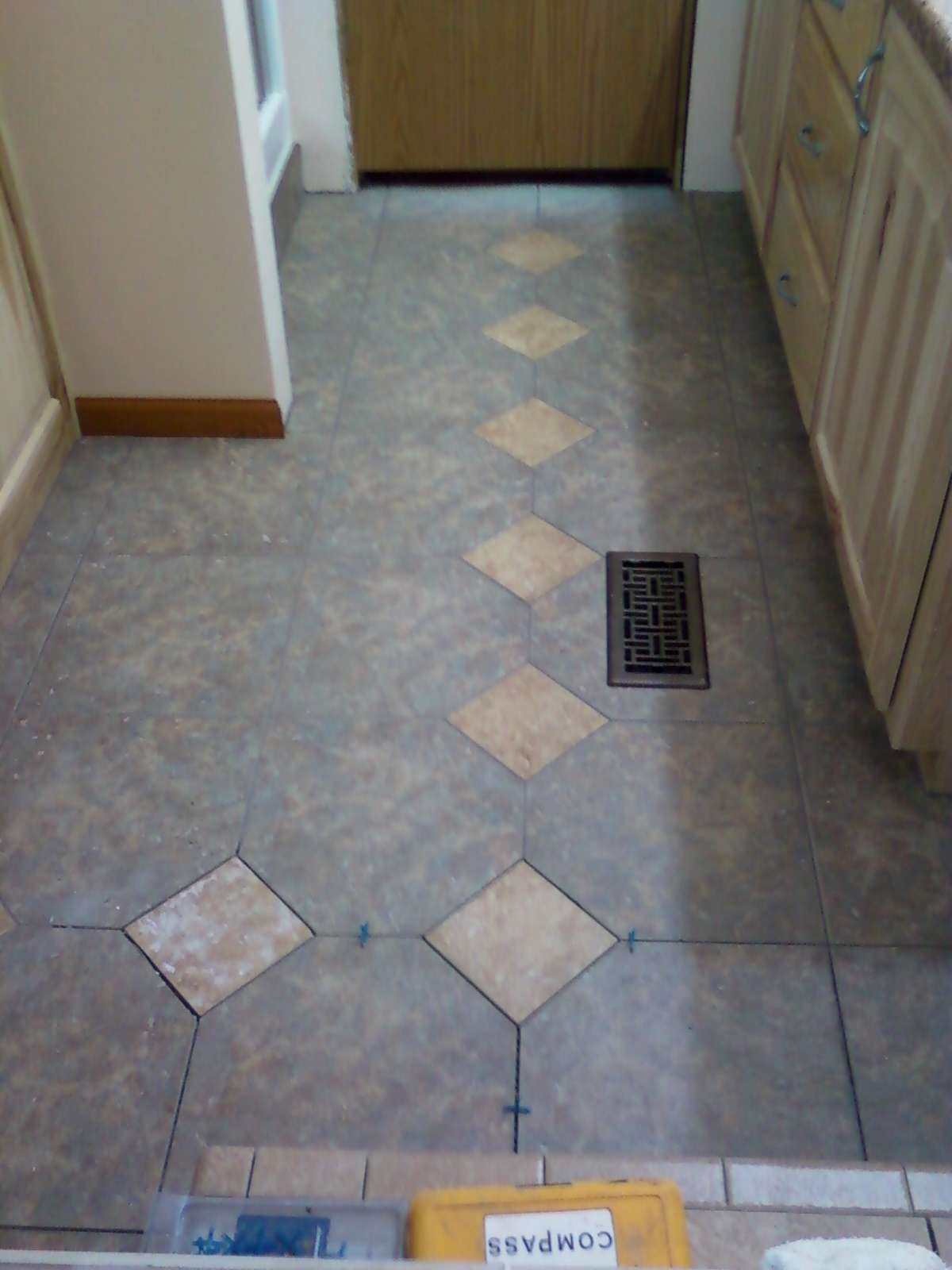 Tiled bathroom floor, inc. diamond insets