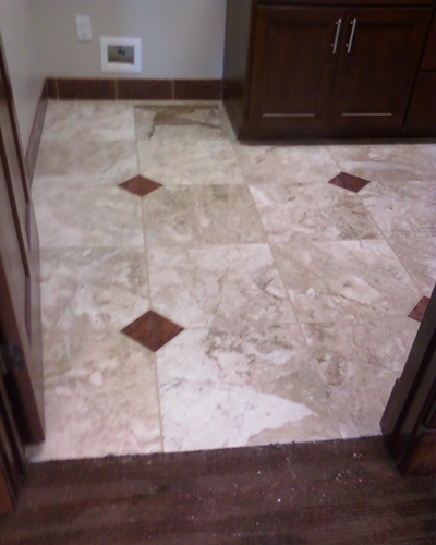 Tiled bathroom floor with diamond insets