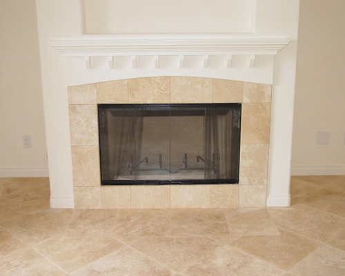 Tiled kitchen floor and fireplace face