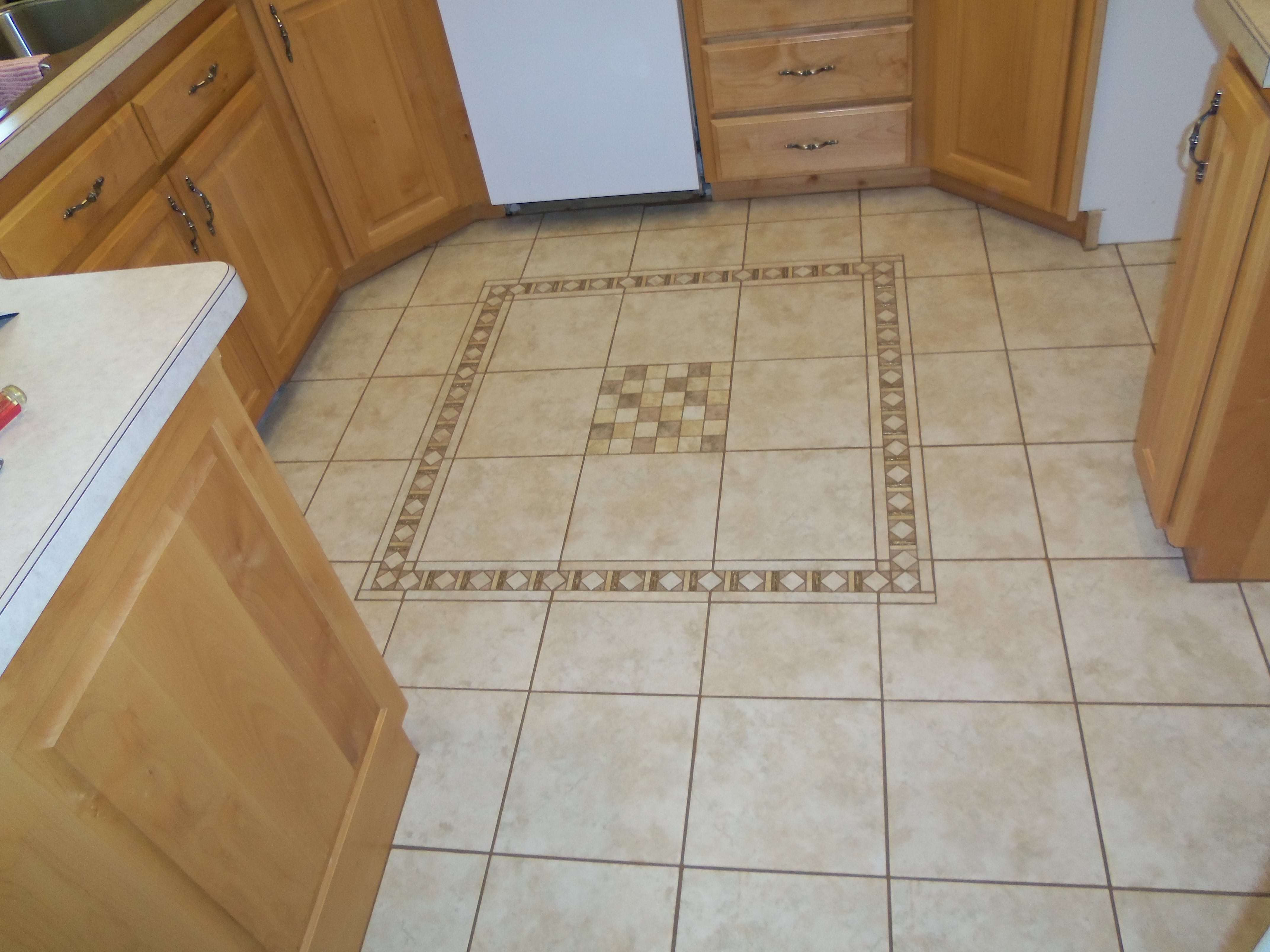 Tiled kitchen floor with a mural