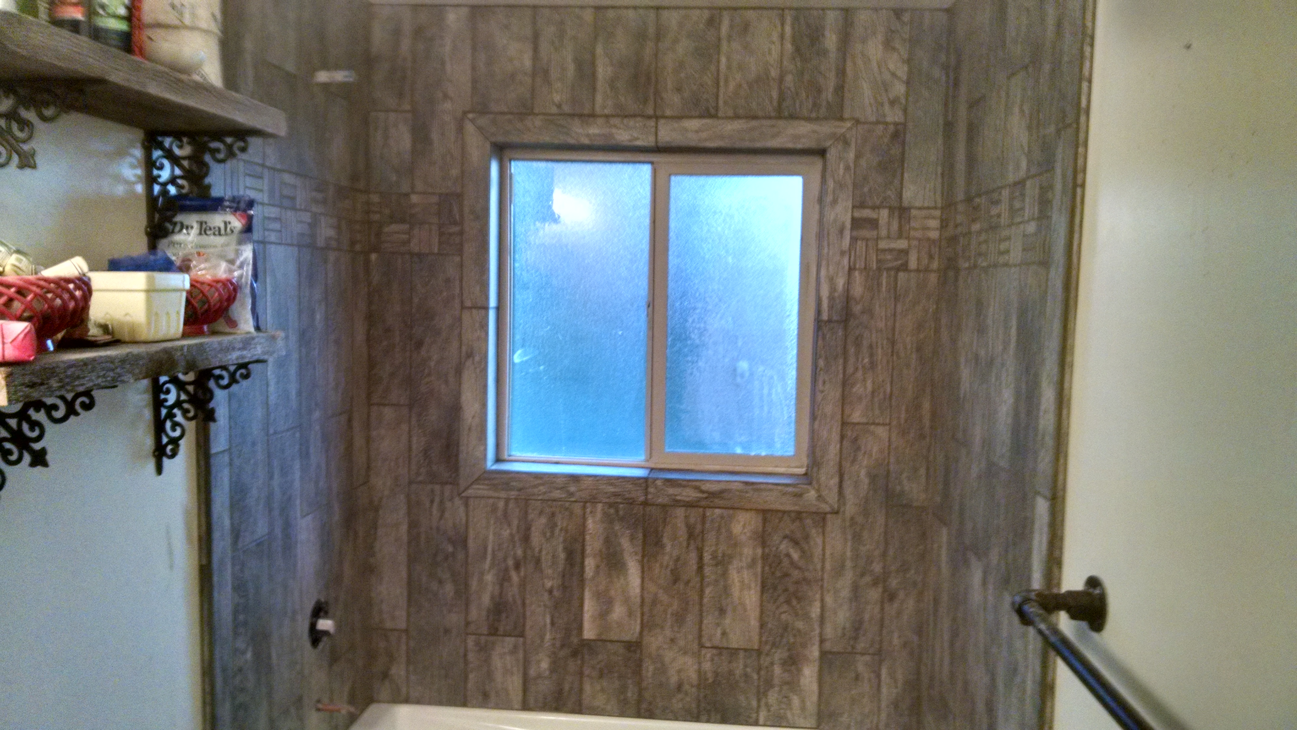 Tub surround, tiled with wook look plank tiles set vertical
