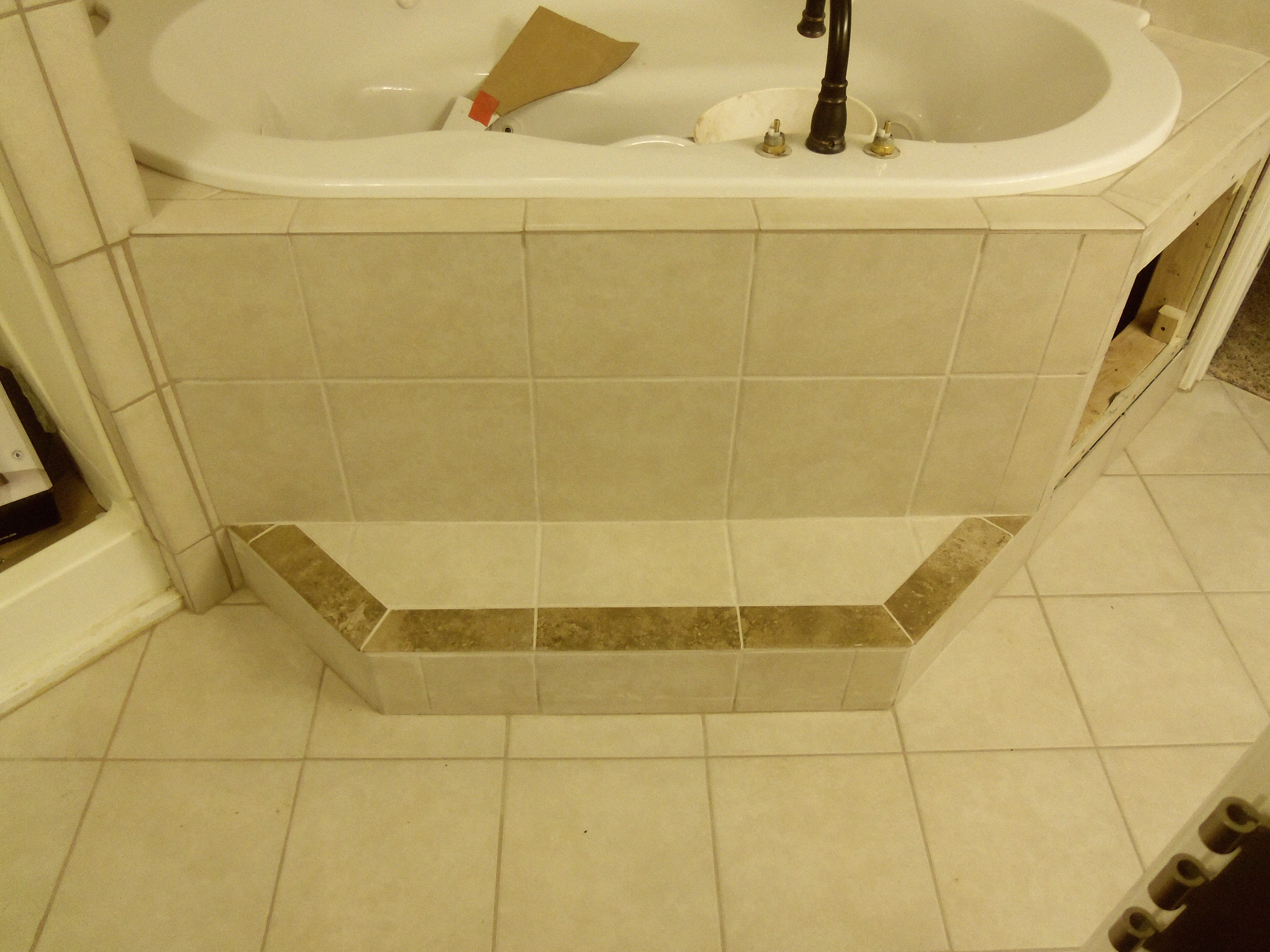 Tiled tub suround, step and floor